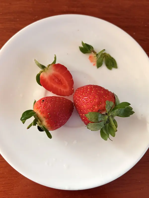 Fresh strawberries on a white plate